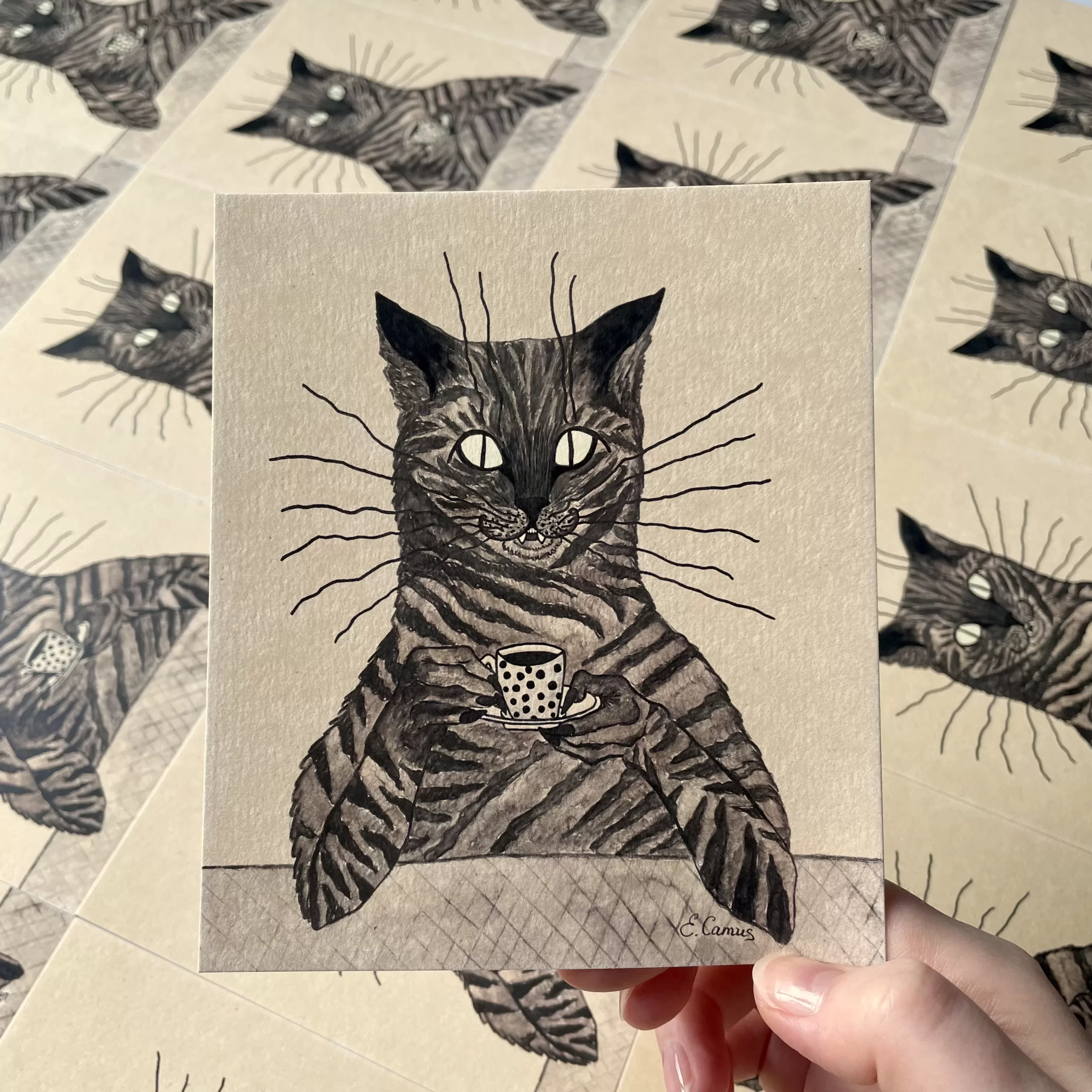 Cat holding a cup of chocolate