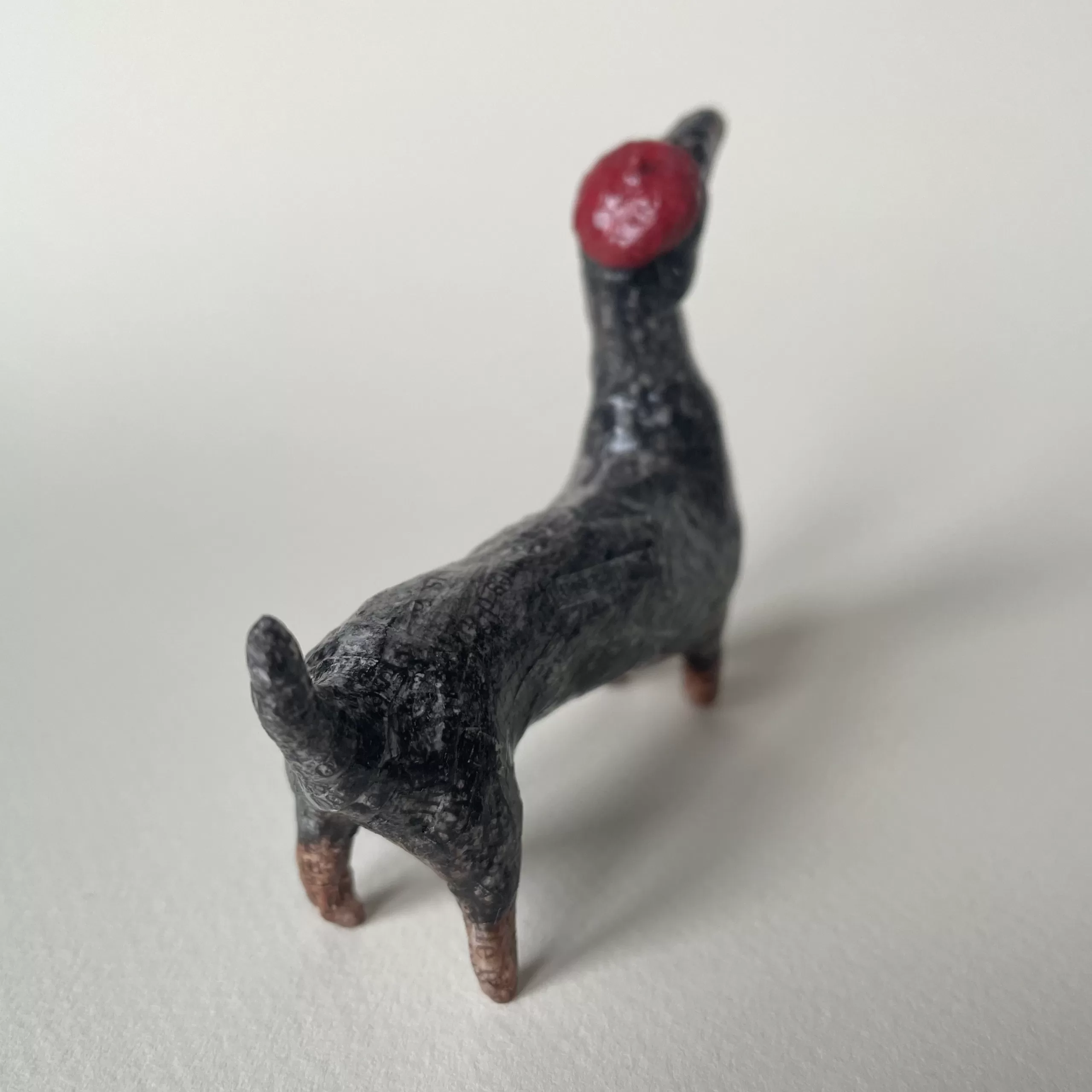 Paper mache miniature figurine of dachshund