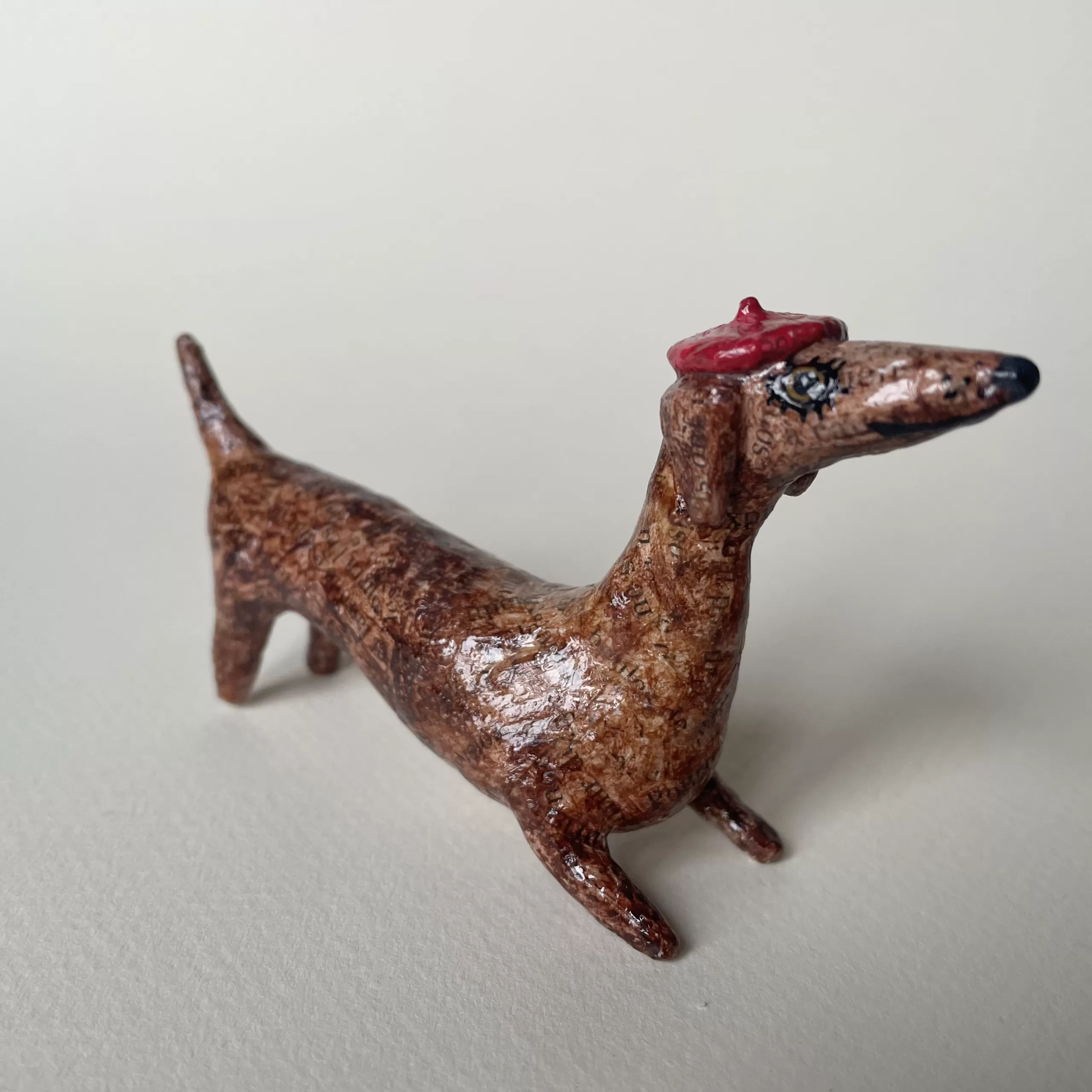 Dachshund paper mache decorative figurine with a french beret