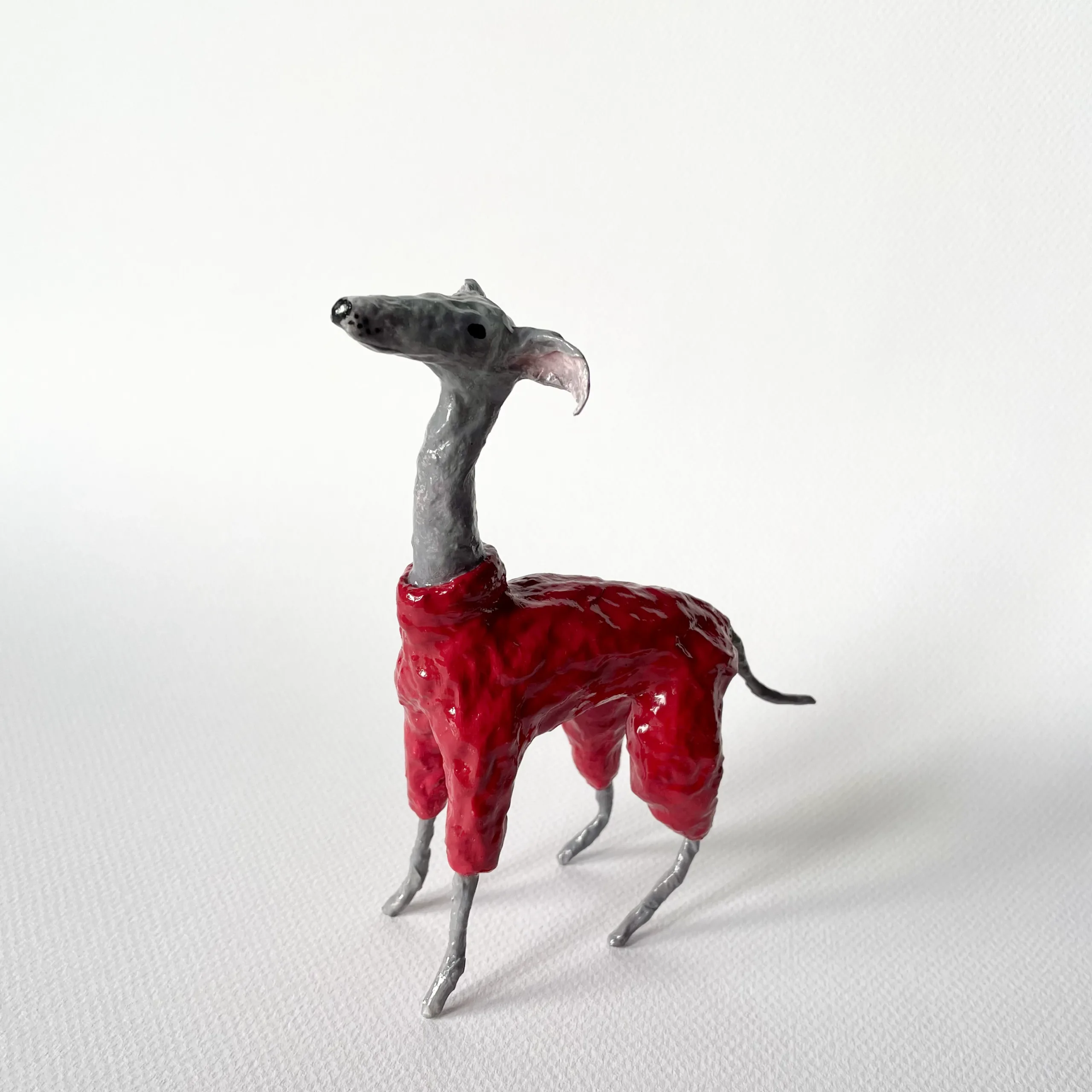 Italian greyhound in red costume paper mache figurine
