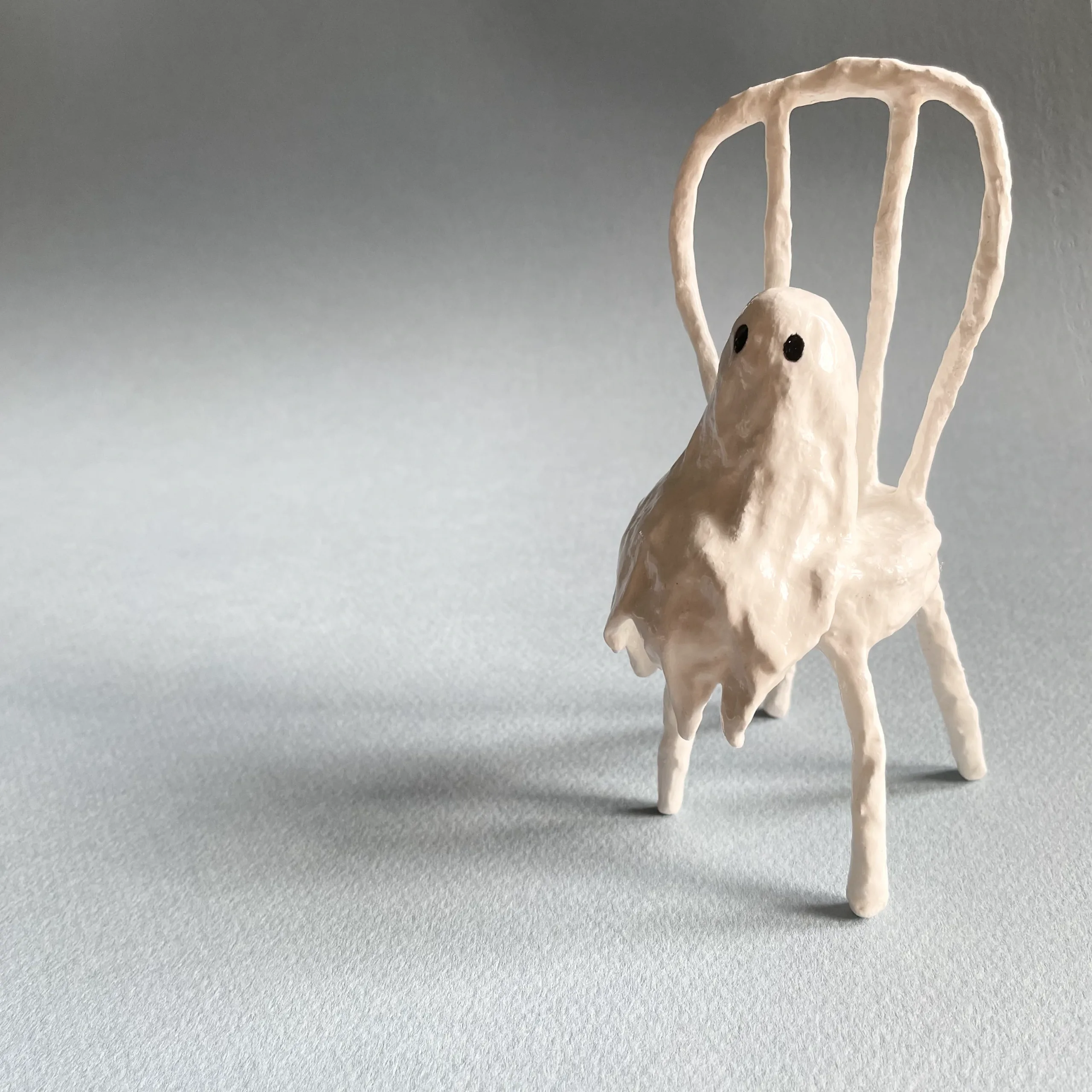 Tiny ghost sitting chair miniature figurine