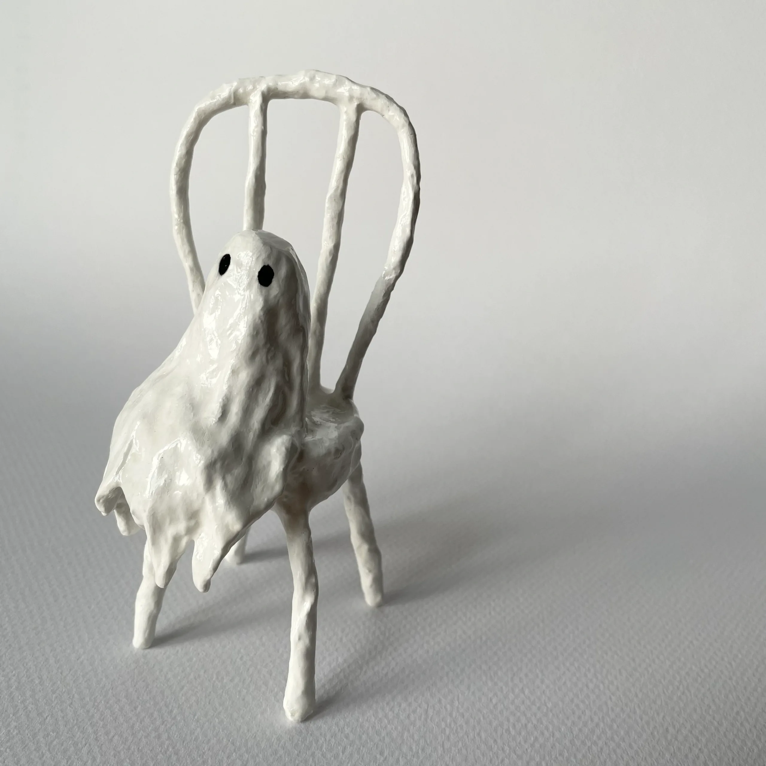 Ghost sitting on chair miniature paper mache figurine